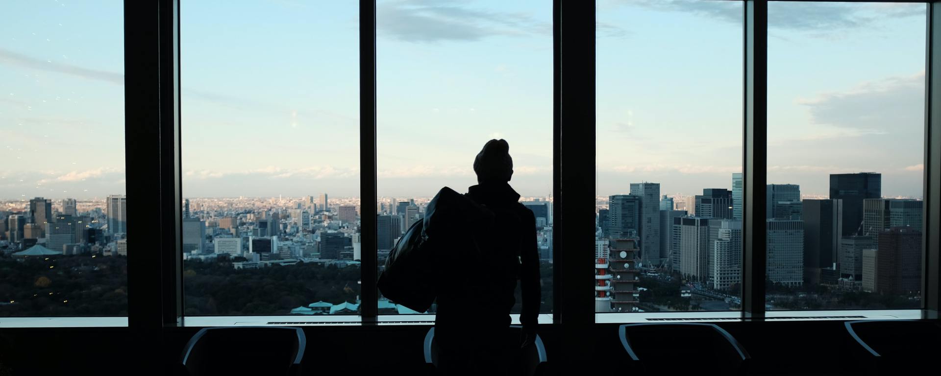 Woman in front of windows