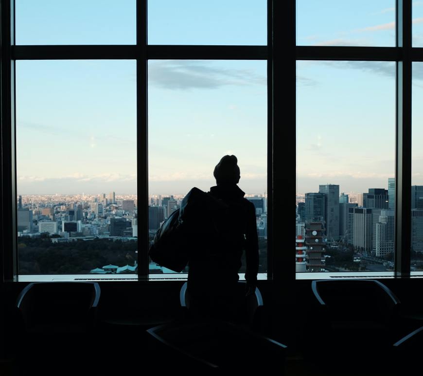 Woman in front of windows